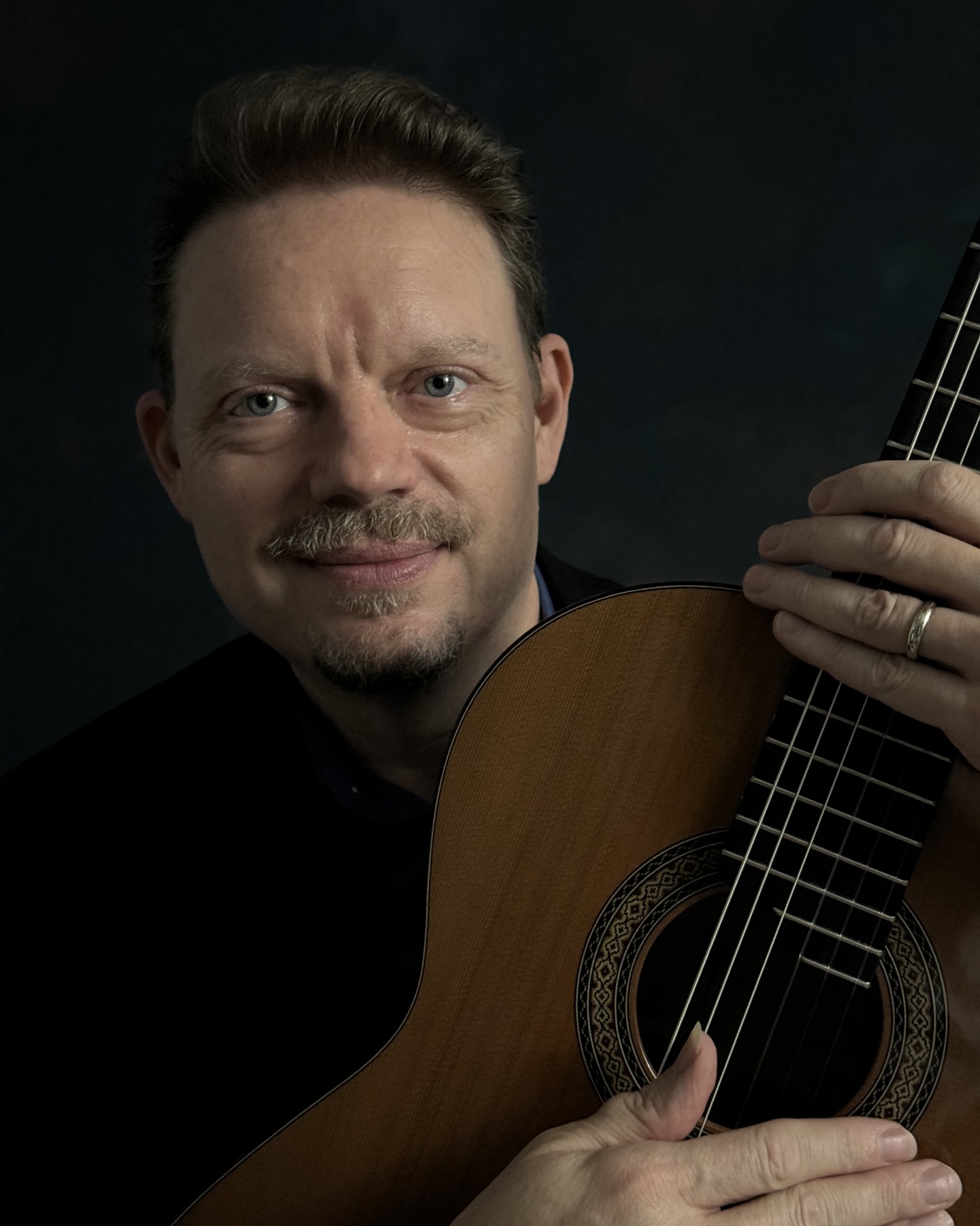 Classical guitarist Luther Enloe with his guitar